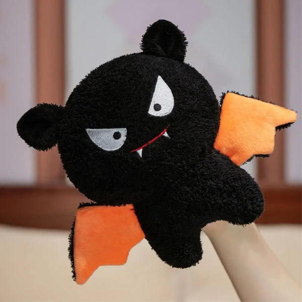 Peluche chauve-souris noire aux ailes orange, format 20 cm