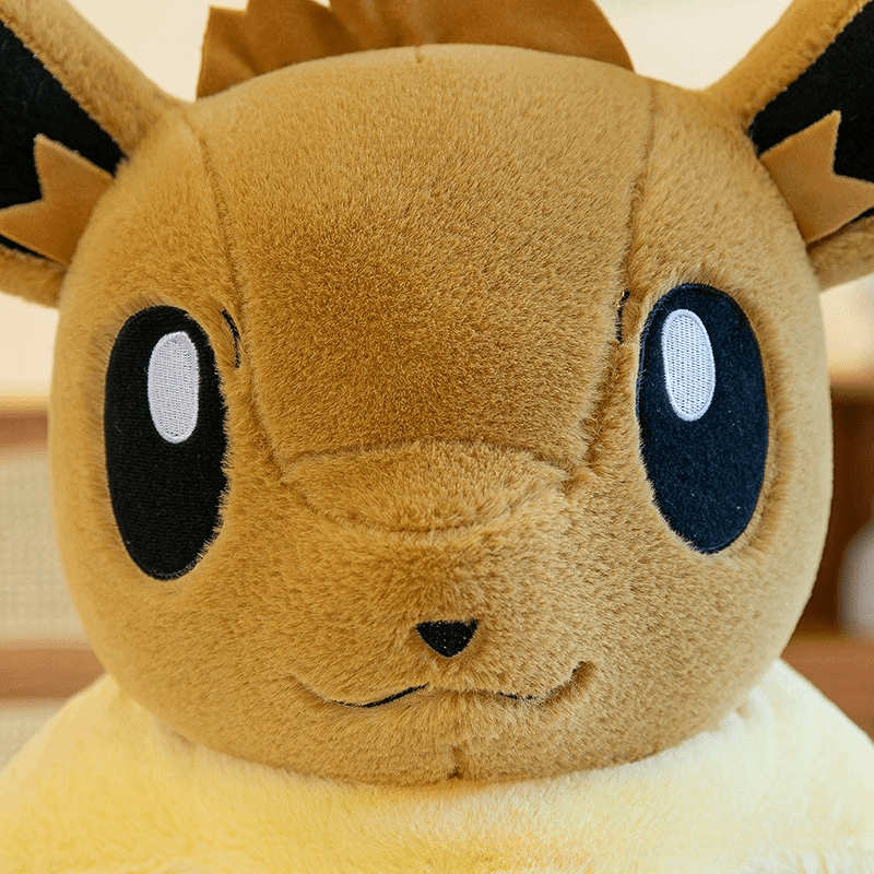 Peluche évoli pokémon assise toute douce