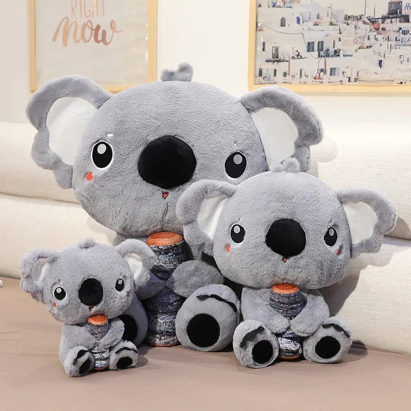 Peluche koala qui câline son bois