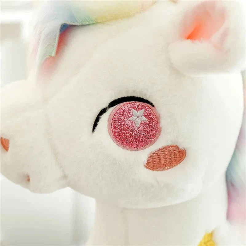 Peluche licorne blanche étoilée avec ailes et corne dorée