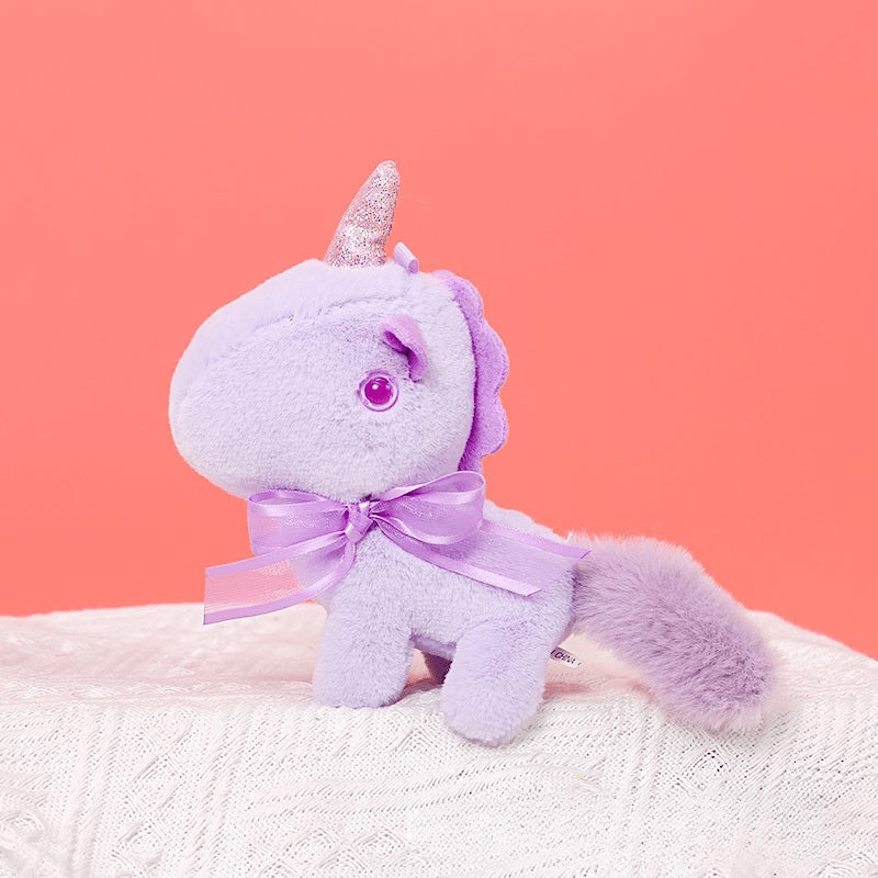 Peluche licorne miniature douce avec nœud et cornet pailleté Violet