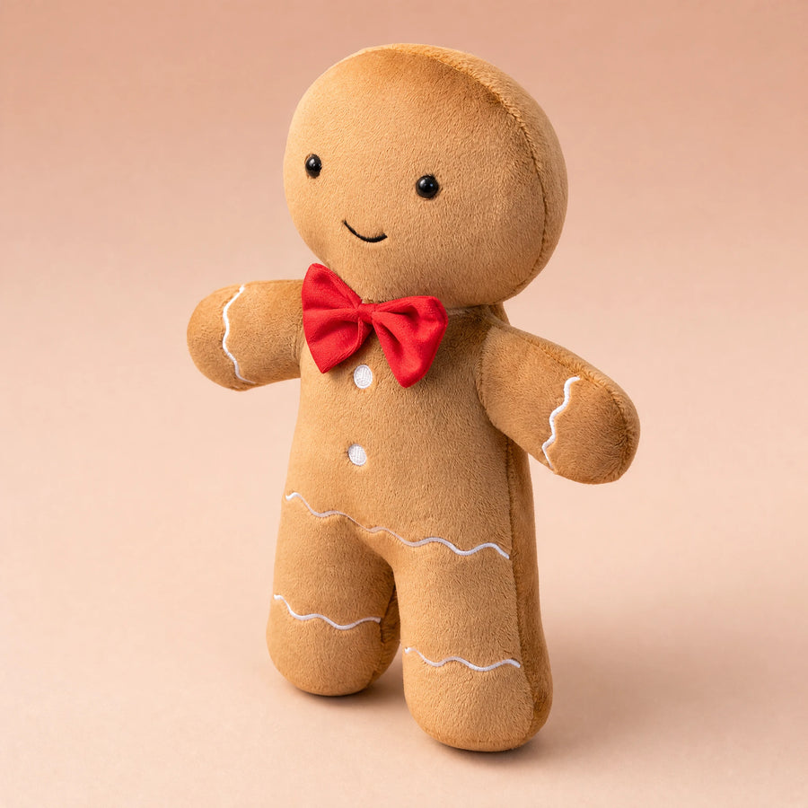 Peluche Pain d'Épice avec Nœud Rouge et Sourire Brodé - Fond beige rosé, autre angle