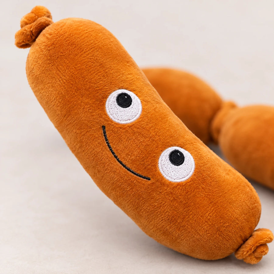 Peluche saucisson géante 70 cm avec petits bras et sourire - Détail matière