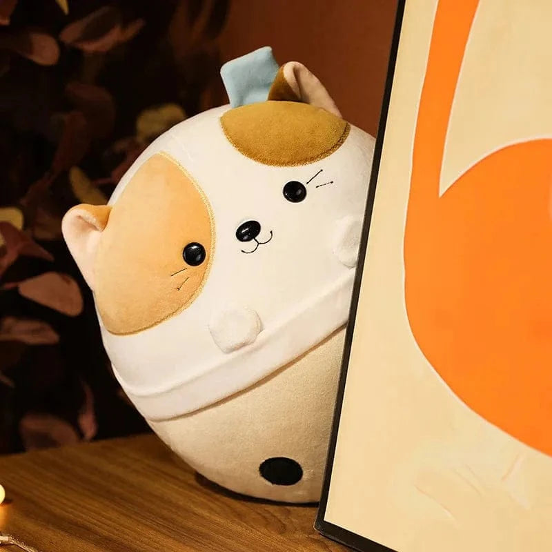 Peluche squishmallow chat dans un bol