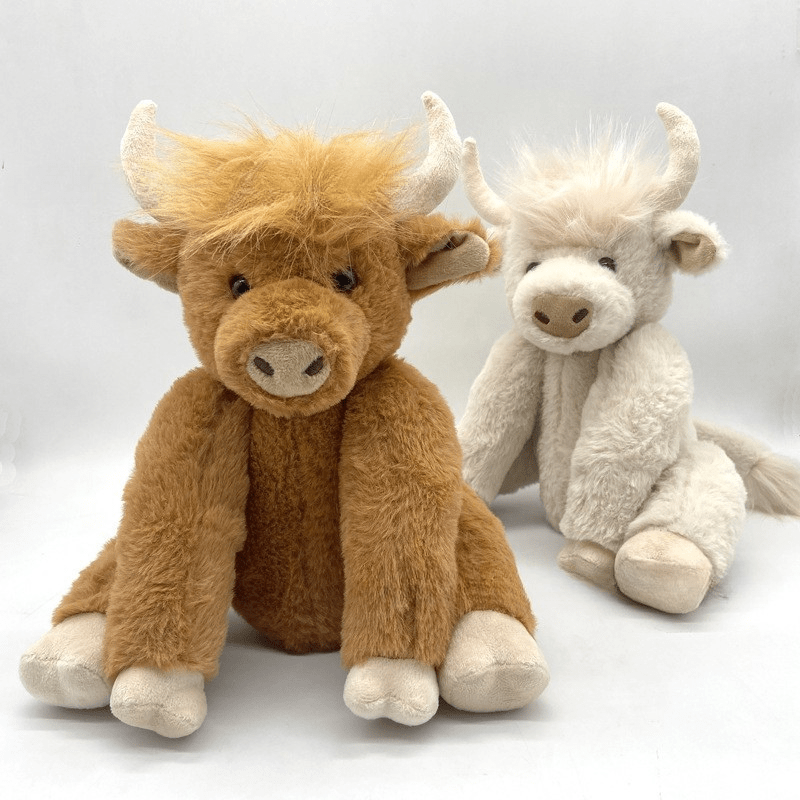 Peluche vache highland blanche avec couronne de fleurs
