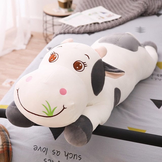 Vache géante en peluche aux grands yeux