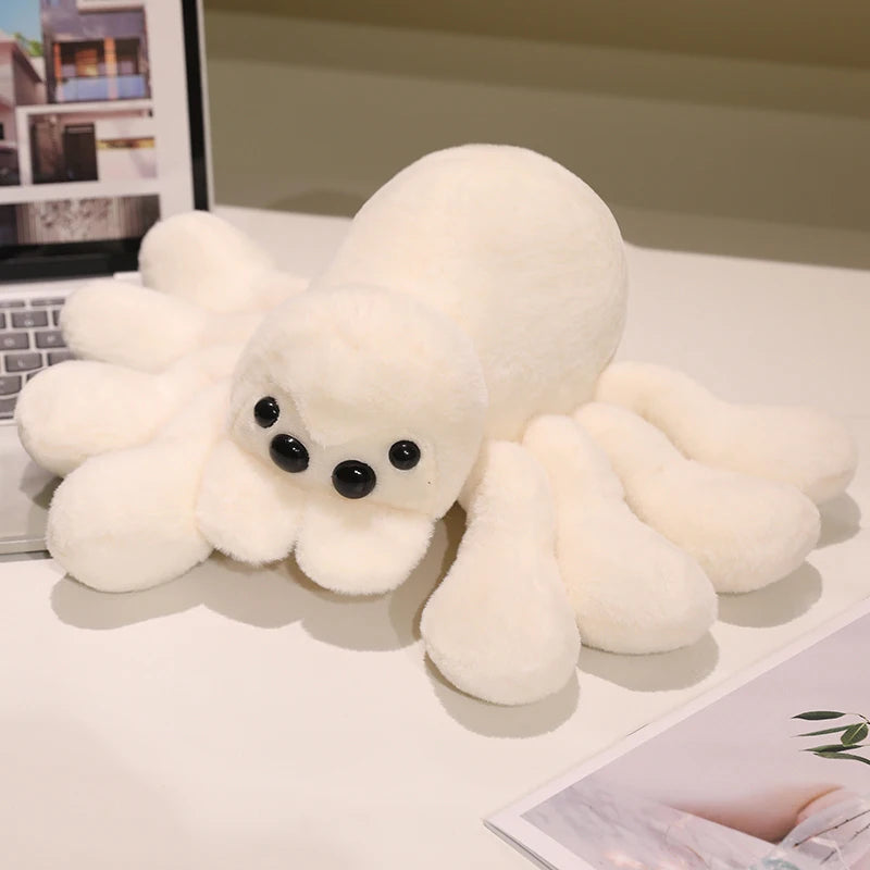 Peluche araignée blanche, huit pattes et yeux ronds apparents