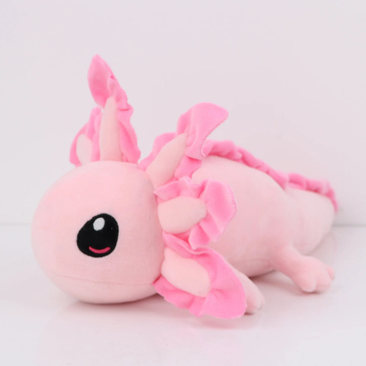 Peluche axolotl rose, branchies disposées en couronne autour de la tête