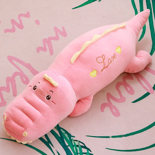 Gentille peluche rose dinosaure remplie de tendresse
