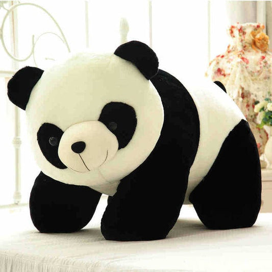 Grosse peluche panda qui aime se faire flatter