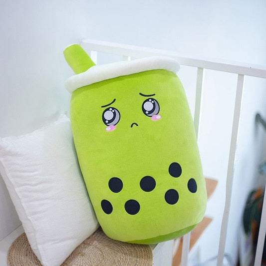 Jouet en peluche en forme de tasse aux yeux brillants