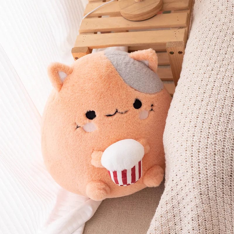 Peluche chat qui mange du popcorn