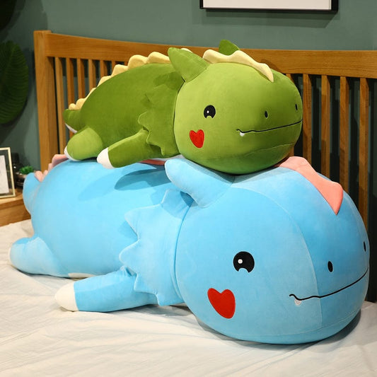 Peluche dinosaure avec un cœur sur la joue