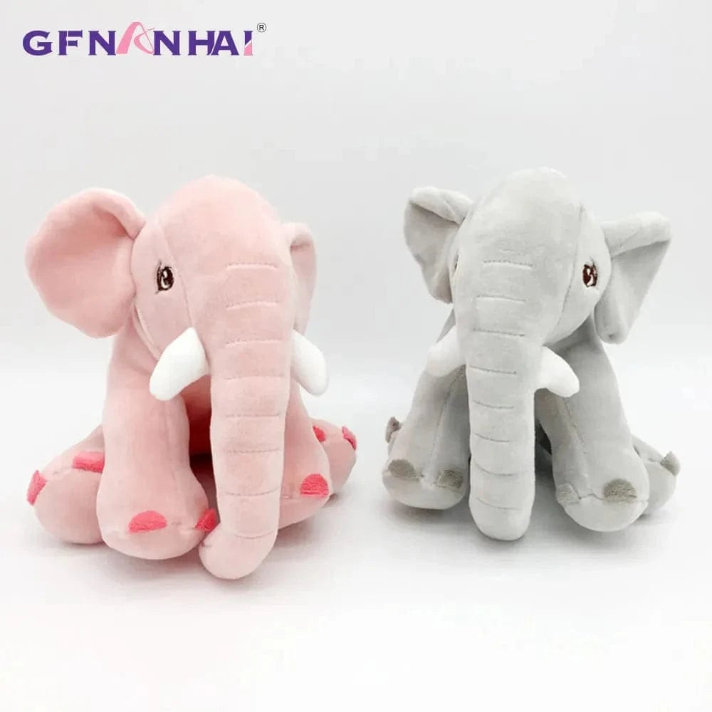 Peluche éléphant assis et content