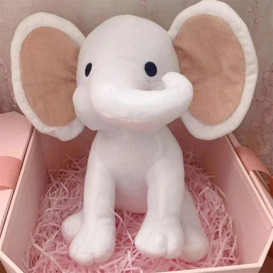 Peluche éléphant coloré avec sa trompe tordue