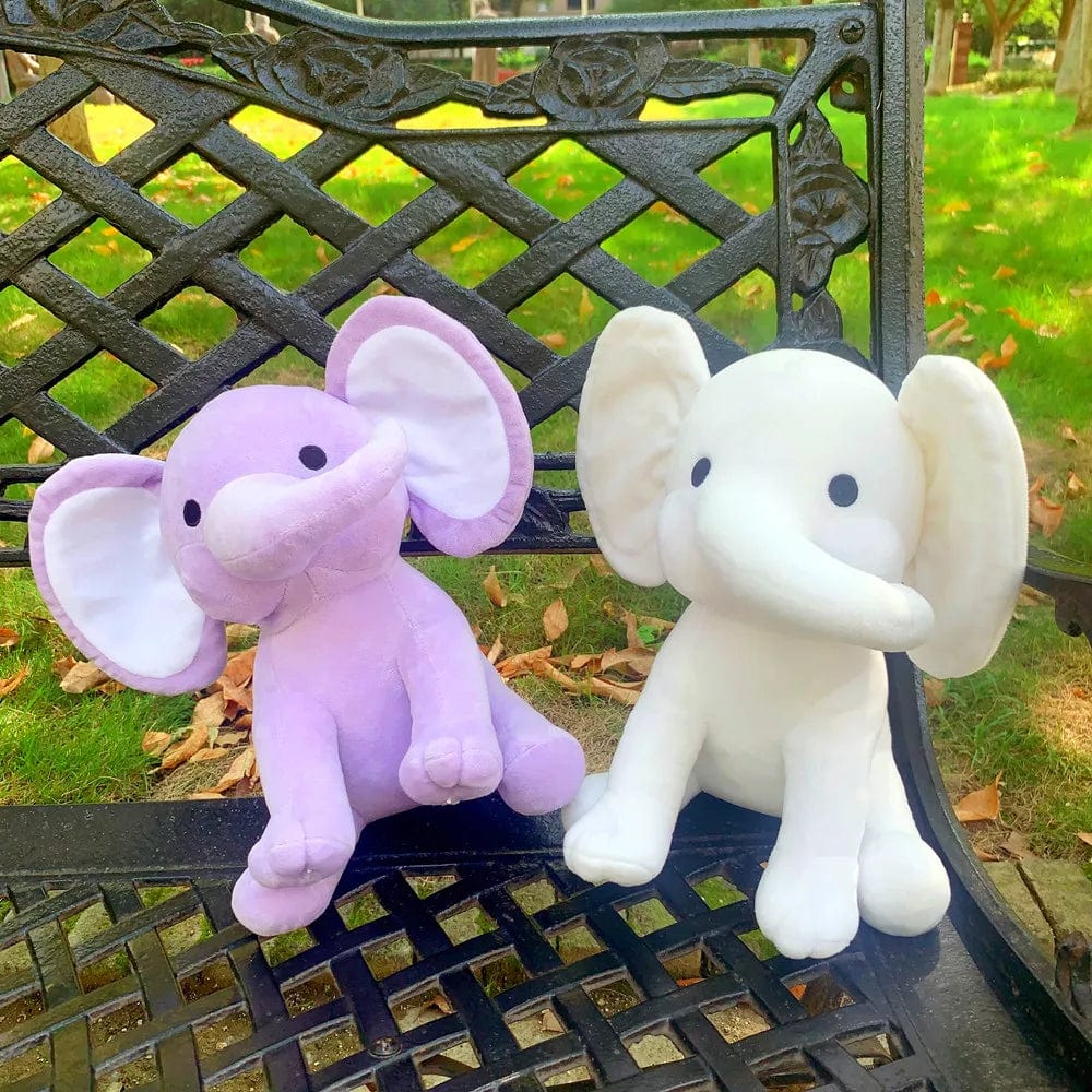 Peluche éléphant coloré avec sa trompe tordue