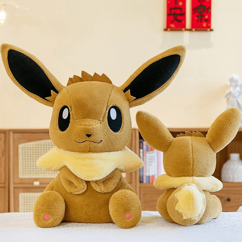 Peluche évoli pokémon assise toute douce