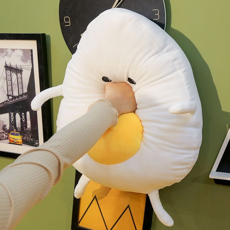 Peluche géante souriante en forme d’œuf