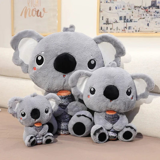 Peluche koala qui câline son bois