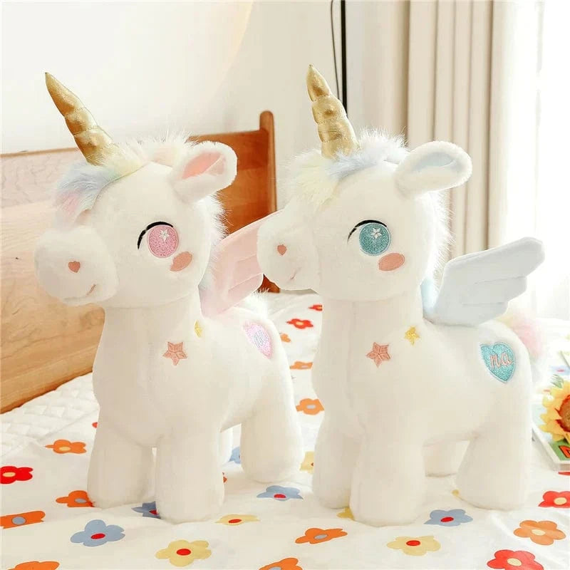 Peluche licorne blanche étoilée avec ailes et corne dorée