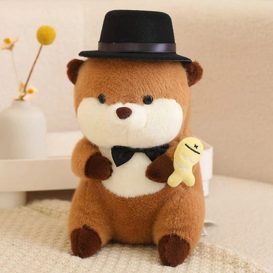 Peluche loutre avec un chapeau qui tient un poisson coloré Jaune