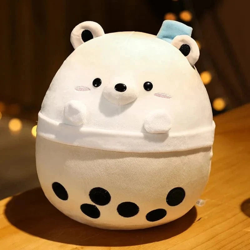 Peluche squishmallow ours blanc dans un bol