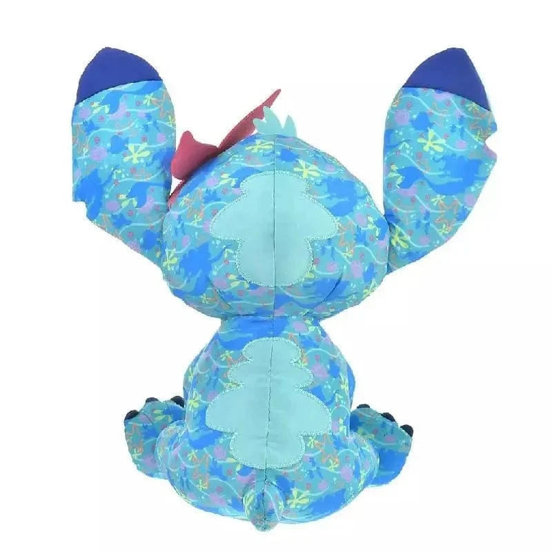 Peluche Stitch bleu clair avec une fleur rose