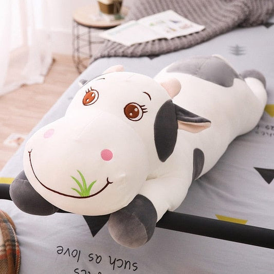 Vache géante en peluche aux grands yeux